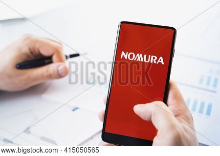 Russia Moscow 29.03.2021 Mobile Phone With Logo Of Nomura Holdings Broker.investment Finance Company
