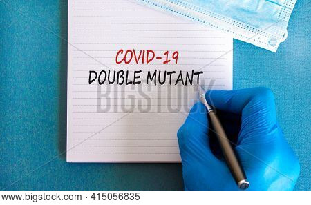 Covid-19 Double Mutant Symbol. Doctor Hand In Blue Glove With White Note. Concept Words 'covid-19 Do