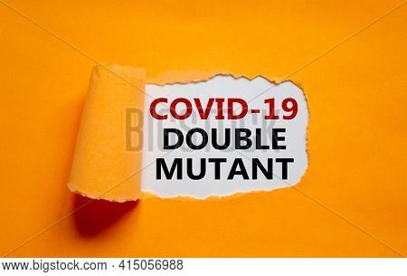 Covid-19 Double Mutant Symbol. Words 'covid-19 Double Mutant' Appearing Behind Torn Orange Paper. Me