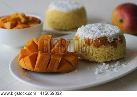 Steamed Ground Rice, Layered With Coconut Shavings And Mango. Locally Known As Mango Puttu. A Tradit