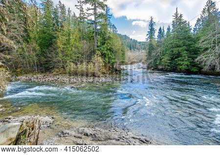 Beautiful Mountain River and suspention bridge at Cal Cheak Recreation Site, Sea-to-Sky Hwy, Whistler, Vancouver, Canada.