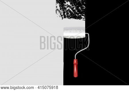 Paint Roller With A Long Stroke Of Black Paint On A White Wall.