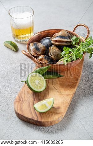 Raw Uncooked Clams Vongole Shells Shellfish With Ingredients For Cooking Coriandr, Beer And Lime In 