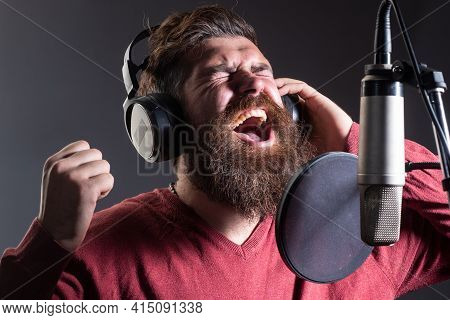 Karaoke Singer. Man Singing With Music Microphone. Expression Face Close Up