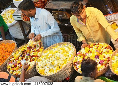 MUMBAI, INDIA - JANUARY 11, 2017: Mumbai Flower Market. The Dadar Flower Market opens at 4am is filled with vendors offering their wares to shop owners, decorators and florists.