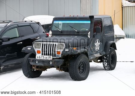 Novyy Urengoy, Russia - March 24, 2021: Old Offroad Car Jeep Wrangler In The City Street.