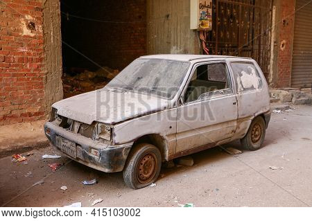 Giza, Egypt - January 26, 2021: Abandoned Russian Minicar Lada Oka In The City Street.