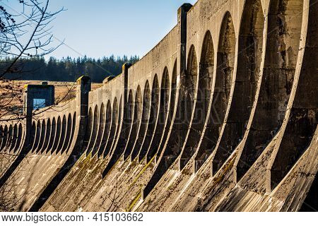 The Architecture Of Clatteringshaws Dam, With Arches Along The Top Of The Curved Dam, Galloay Hydro 
