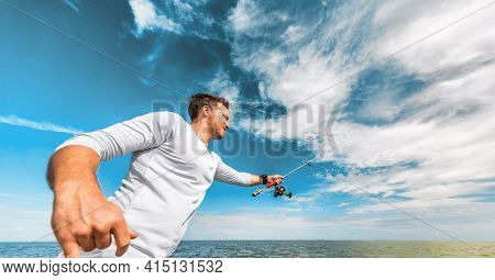 Fishing man casting line recreational activity during summer. Fisherman outdoor on blue sky banner crop background. Sport fishing fish.
