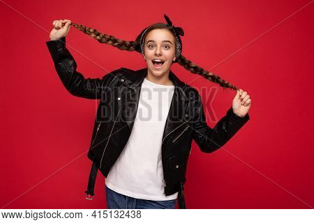 Photo Shot Of Charming Positive Amazing Brunet Little Female Teenager With Pigtails Wearing Stylish 