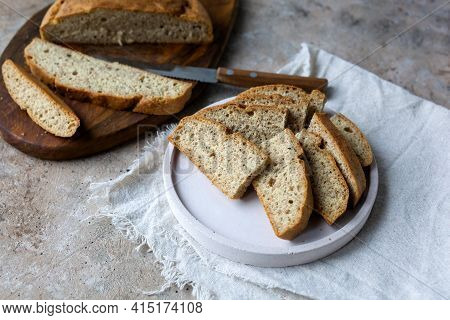 Low Carb Ketogenic Bread On Plate On Beige Stone Concrete Background