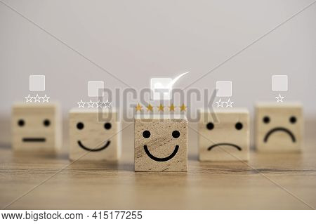 Customer Satisfaction Survey Concept, Human Face Icons Print Screen On Wooden Cube Block With Stars 