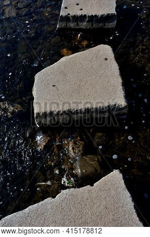The Path Continues To The Water Along Large Stones, Between Which Water Flows. An Impromptu Trail Fo