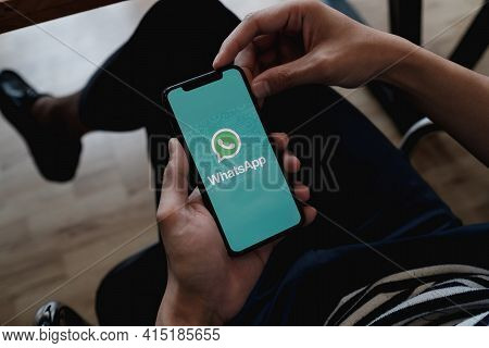 Chiang Mai, Thailand - Jan 23, 2021 : Aan Holding A Iphone X And Open Appstore Searching Social Inte