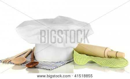 Kochmütze mit Geschirr und Federballschläger, isolated on white