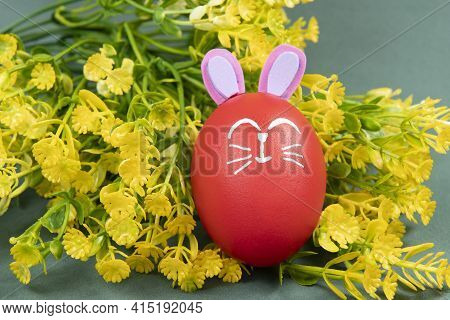 Egg With Easter Rabbit Drawn On Green Background