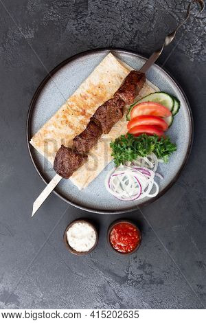 Beef Shashlik On A Skewer In A Plate.