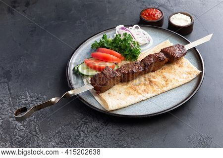 Beef Shashlik On A Skewer In A Plate.