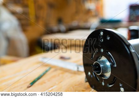 Close Up Of A Router Base Plate, Sharp Flattening Router Bit In A Small Workshop, Shallow Depth Of F