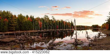 Canadian Landscape View By The Lake During Fall Season. Colorful Sunrise Sky Art Render. Taken At Gr