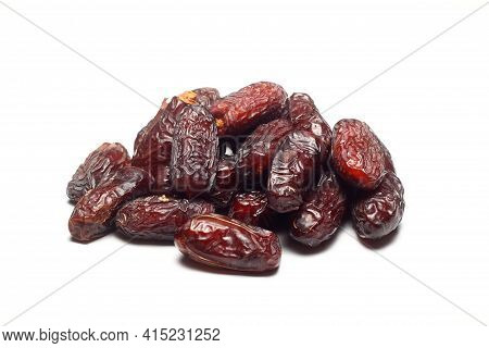 Dates On A White Background. Dried Fruits. Dried Dates Lie Next To Each Other