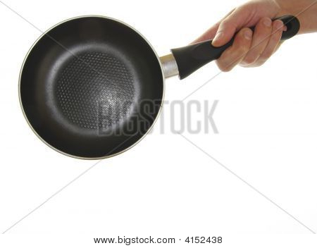 捕捉铁锅烹饪的男人的手