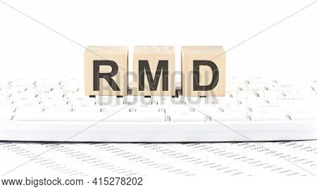 Rmd -word Wooden Block On The Keyboard Background Witn Chart