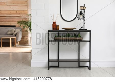 Console Table With Decor Near Mirror In Room. Interior Design