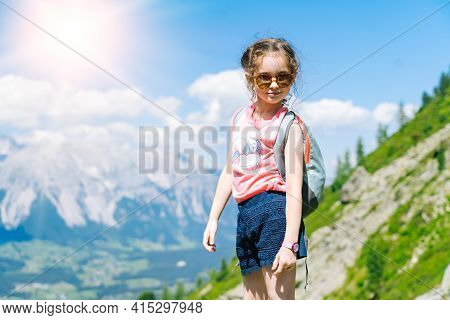 Children Hiking On Beautiful Summer Day In Alps Mountains Austria, Resting On Rock And Admire Amazin