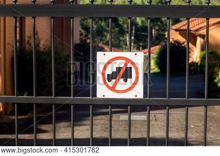 No Truck Sign On A Metal Fence Of Residential Buildings Area