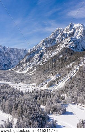 Aerial View Of Ski Jump In Planica, Slovenia At Ratece Near Kranjska Gora In Winter With Snow.