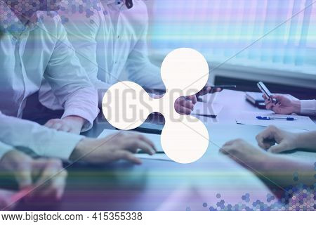 Ripple, Xrp Cryptocurrency Sign. The Concept Of Business, Cryptocurrency And Finance - A Team Of Bus