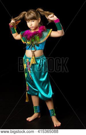 Girl Dancer Wearing Bright Ethnic Costume. Photo Session In The Studio