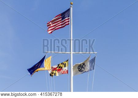 Silverspring, Md, Usa 11-14-2020: A Nautical T Shaped Flag Pole With The Us Flag On Top And Governme