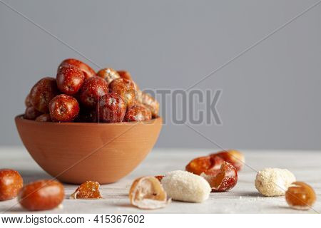 Ripe Fruits Of Cultivated Eleagnus (silverberry) Plants. The Nut Sized Brown Fruit Has A Thin Skin. 