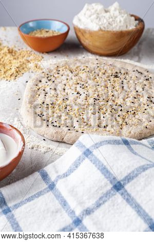 Homemade Turkish Flat Bread Known As Ramazan Pidesi, Tirnak Pidesi Or Pide. A Hand Rolled Rounded Fl