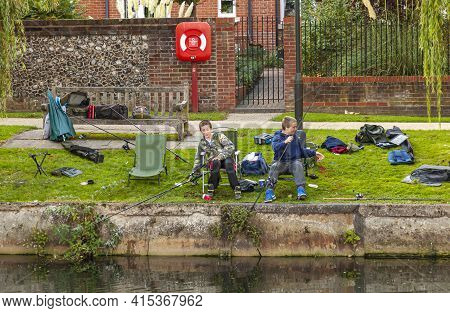 10-07-2012 Norwich, Uk: Two Teen Boys Are Spending Their Time After School Fishing In The Local Yeo 