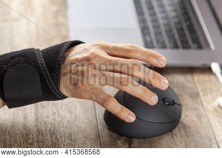 Chronic Trauma To The Wrist Joint  In People Using Computer Mouse May Lead To Disorders That Cause I