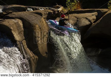Ohiopyle Falls, Pa, Usa 10/01/2017: A Kayaker Wearing A Red Helmet With Camera Attached To It Is Doi
