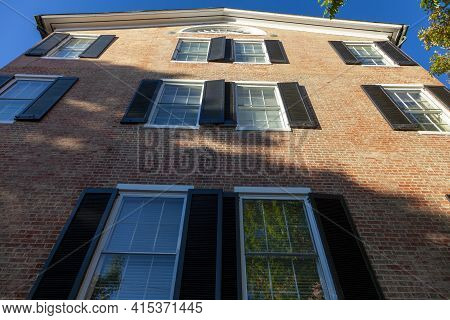 Frederick, Md, Usa: 10/13/2020: A Brick Apartment Building In Downtown Frederick With Tall Windows A