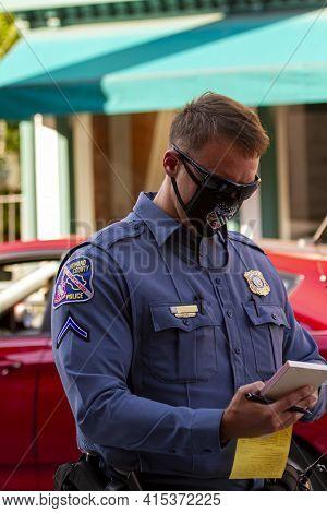 Ellicott City, Md, Usa 10/07/2020: Close Up Image Of A Young Caucasian Police Officer Working In How
