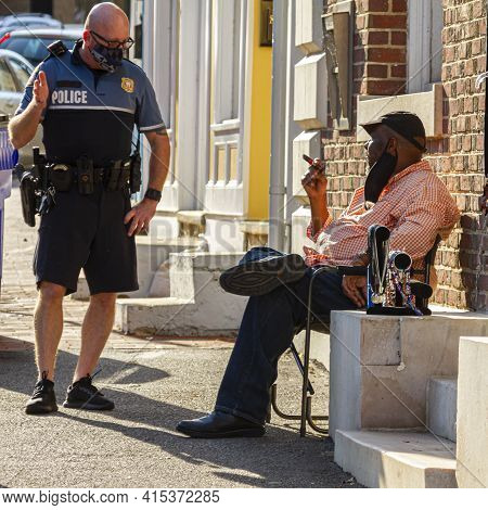 Ellicott City, Md, Usa 10/07/2020: A White Police Officer With Shaved Head Who Is Wearing  Short And