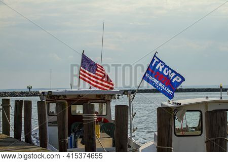 Rock Hall, Md ,usa 08/18/2020: Trump 2020 Flag Waving On A Flag Post At The Back Of A Boat. The Flag