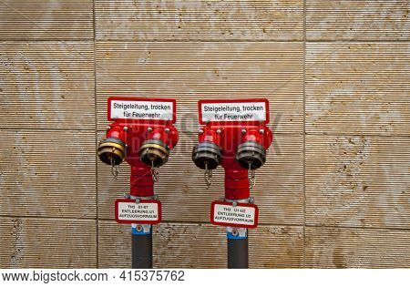 Berlin, Germany 09/14/2009: An Isolated Red Metal Dry Riser Standpipe System For Use By Fire Brigade