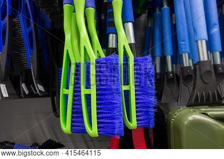 Brushes And Scrapers For Cleaning Car Snow Hang In The Supermarket. Copy Space.
