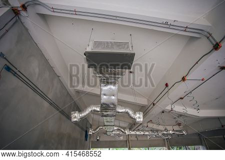 Ducting Work For Air Conditioner Ceiling Type. Installation Ac Ductwork In The Construction Site.