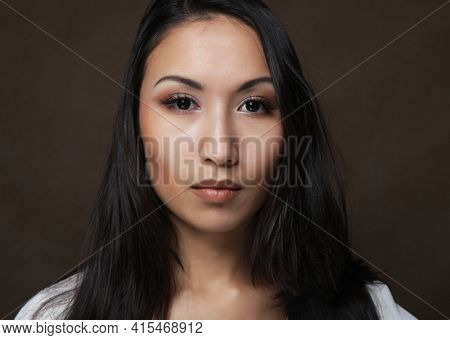 Asiam woman with long hair, close up