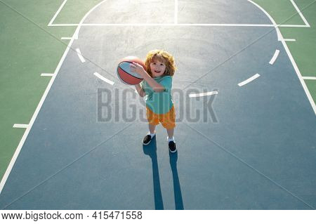 Cute Litle Child Boy Training Basketball. Kids Basketball School