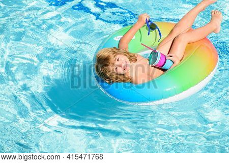 Portrait Of A Kid Laughing In A Swimming Pool. Cocktail On Watter Pool In The Summer