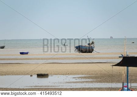 Fisherman's Fishing Boat On Sand At A Fishing Village Beach There Is An Island And Sea Background Wi